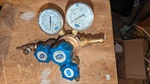 Union Carbide UPE-3-75-580 Regulator W/fittings. Fixed Price $39.00.